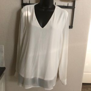 White sheer blouse with lining.